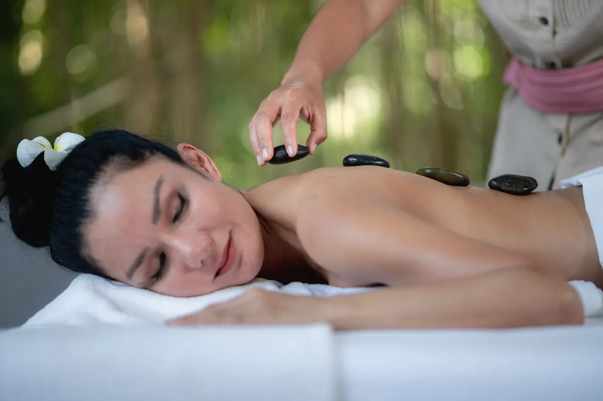 A hot stone massage in the spa at Absolute Sanctuary